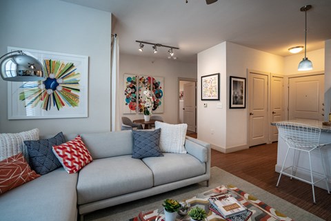 a living room and dining room with a couch and a table